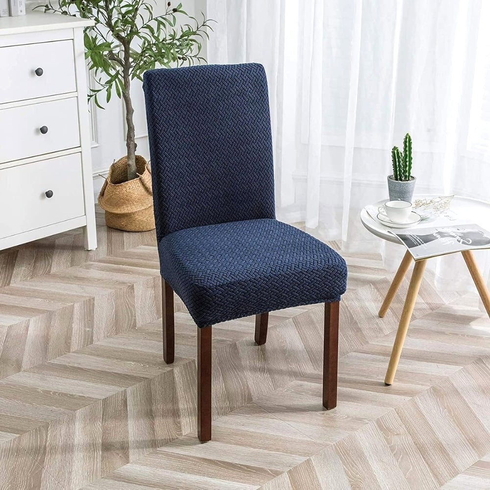 Navy Blue Veluxe Haven Jacquard Velvet Dining Chair Cover with Stretch Fit, showcasing its elegant texture and snug fit on a dining chair in a modern home setting.