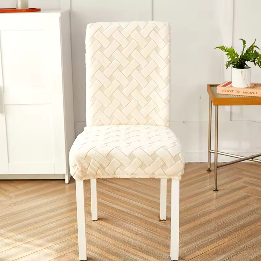 Haven Weave Jacquard Chair Cover in Creamy Beige, showcasing its elegant woven pattern on a dining chair in a home setting.