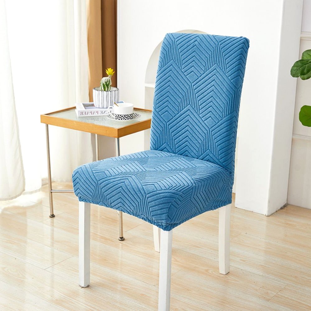Velvet Haven Elastic Jacquard Chair Cover in Ocean Blue with Chevron Maze pattern, showcasing its stretch fit on a dining chair. Ideal furniture protection modern home decor.